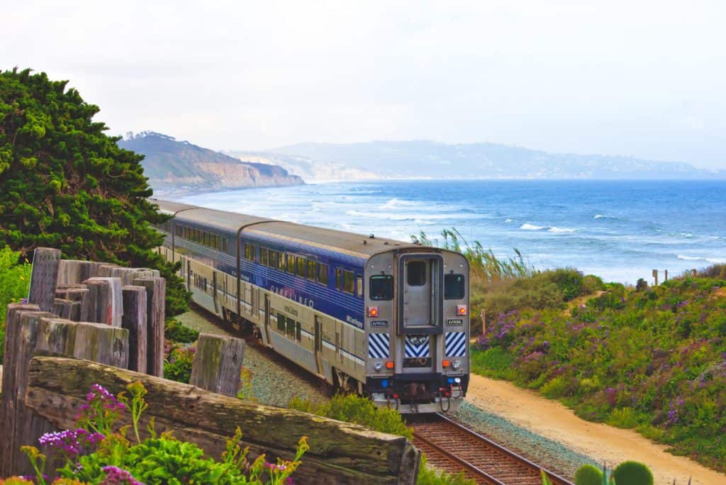 train through the countryside in Europe - Get views like this on your travels with the Eurail Pass to get from place to place